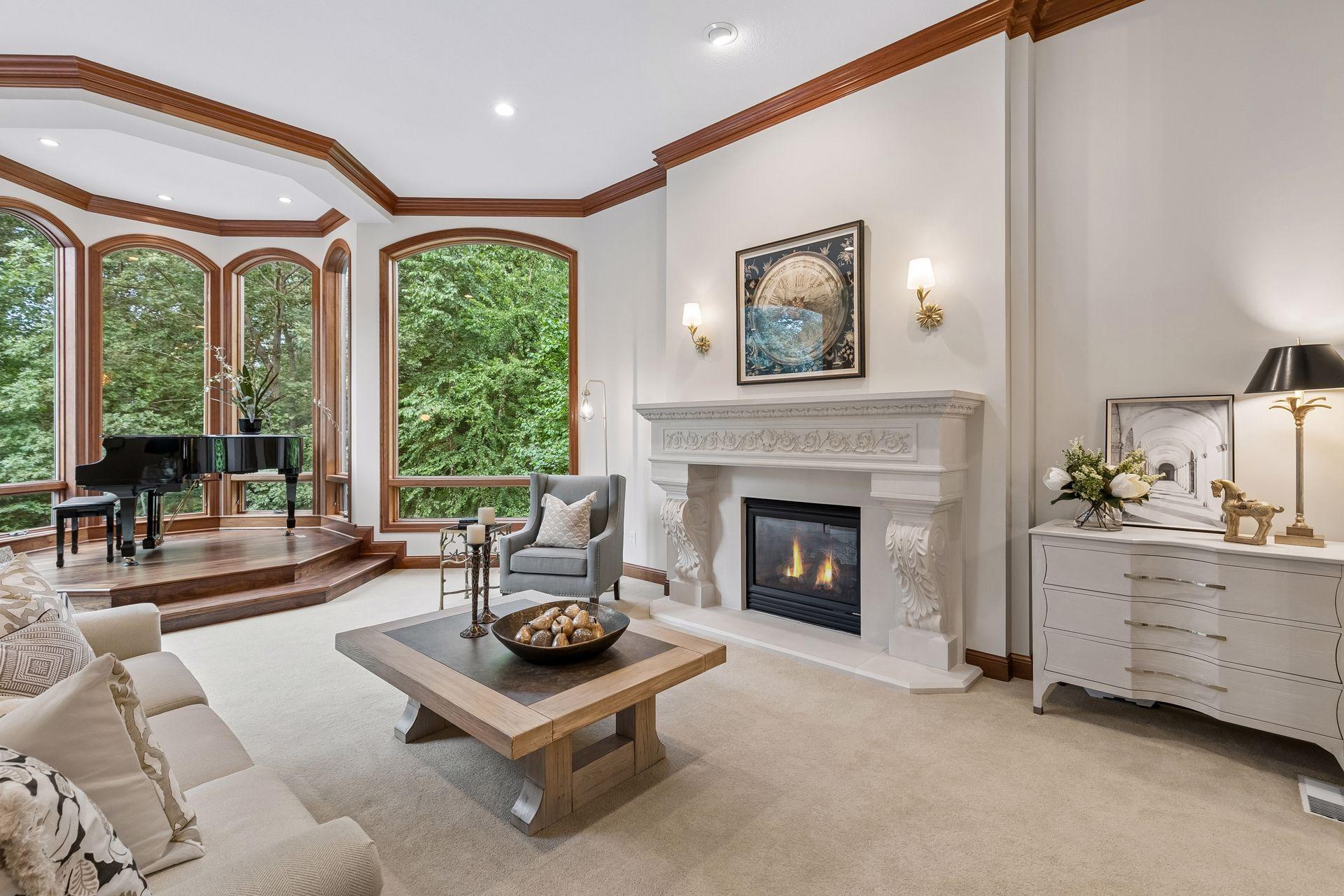 Unique two-sided fireplace highlighted with gold sconces