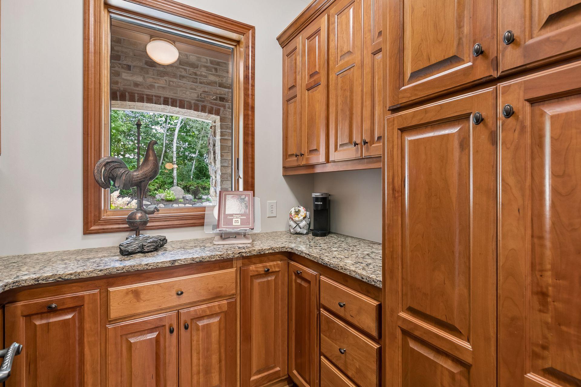 Designer Walk-in Pantry with views of the front yard