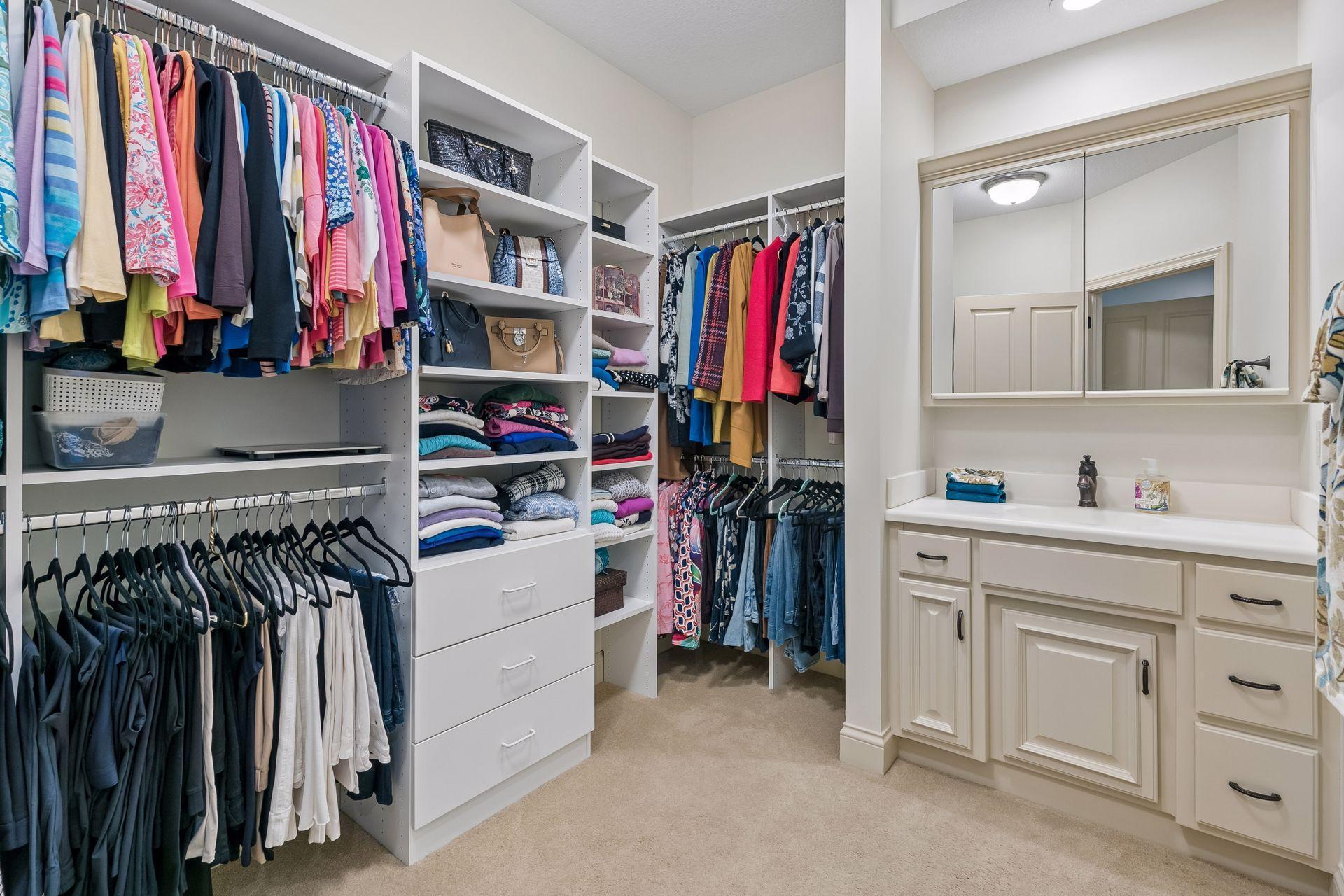 His dressing room with built-in cabinets and a sink