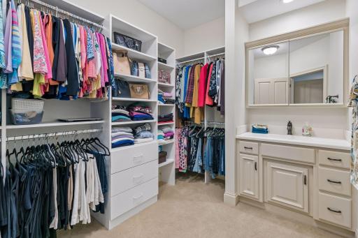His dressing room with built-in cabinets and a sink