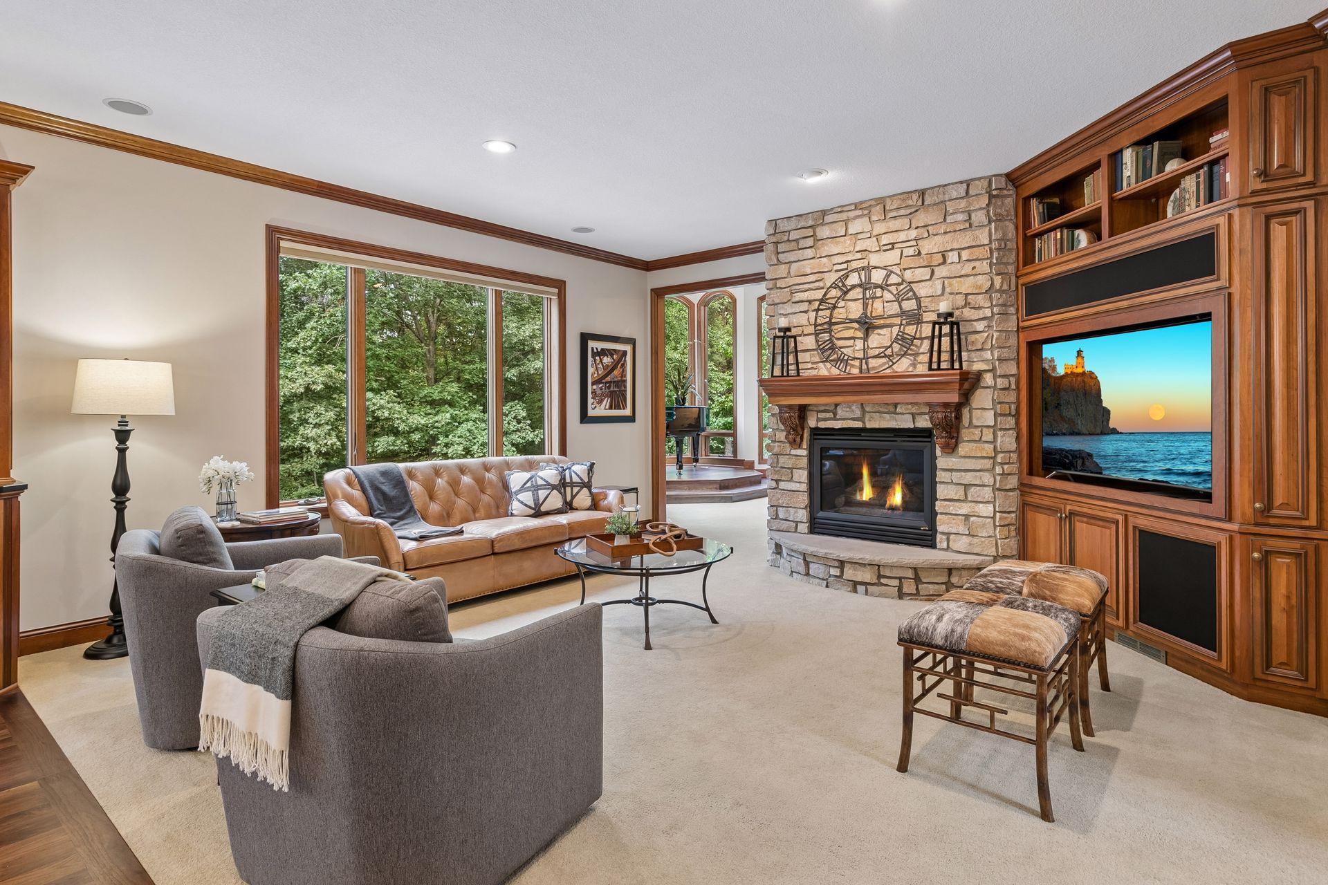 Hearth room with Colorado stone gas fireplace with built-in media center