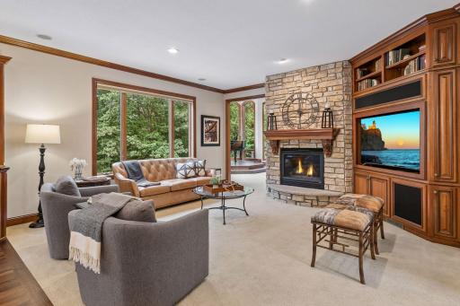 Hearth room with Colorado stone gas fireplace with built-in media center