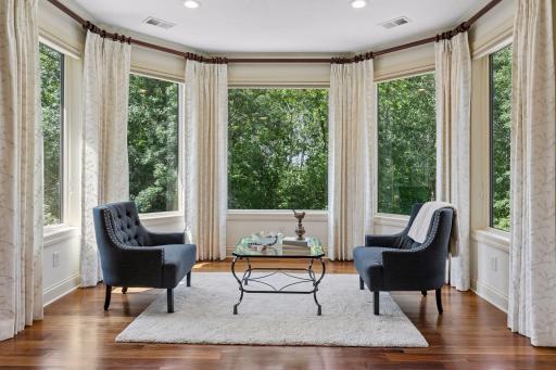 Primary bedroom sitting area overlooks the phenomenal bluff views