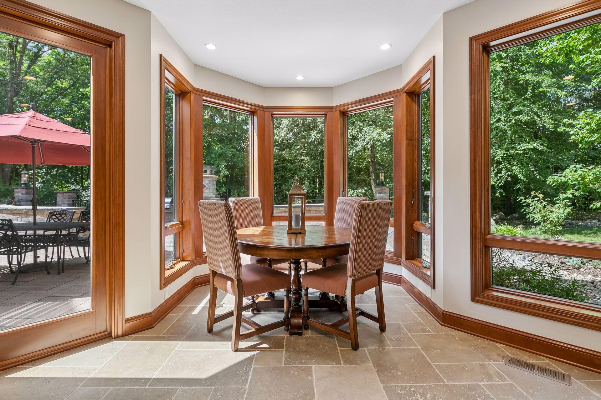 Circular alcove provides the perfect location for playing cards or games while overlooking the backyard