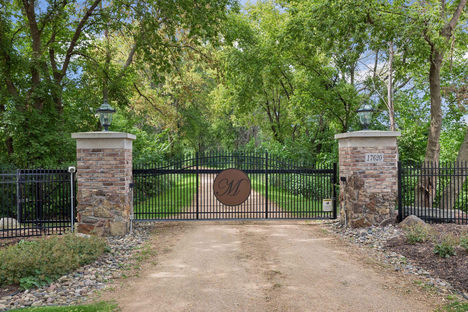 Private gated entrance with integrated security cameras and access code