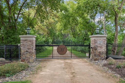 Private gated entrance with integrated security cameras and access code