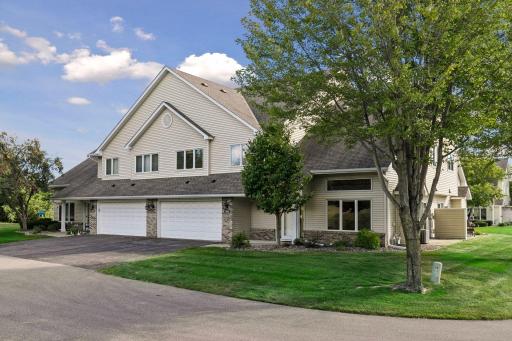 Welcome home to 1842 Cliff Lake Court featuring an attractive exterior, mature landscaping, spacious driveway and attached garage