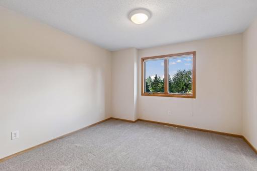 Second bedroom with brand new carpet. The whole home was freshly painted throughout.