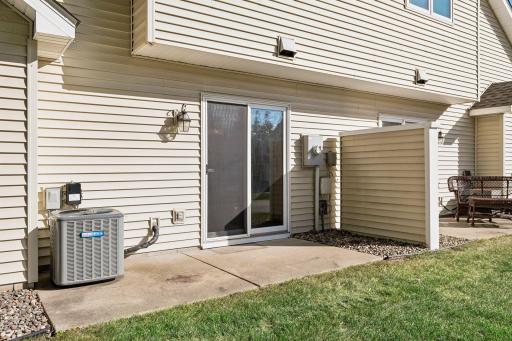 Private patio just off the dining area, offering convenient outdoor space for relaxing or having a meal. Newer furnace and AC.
