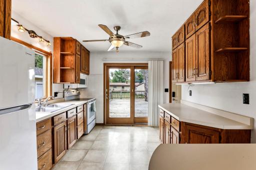 Bright Kitchen with Abundant Cabinetry & Deck Access