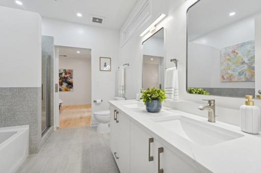 A dual-sink vanity offers daily luxury with ample space and refined finishesâideal for peaceful morning routines.