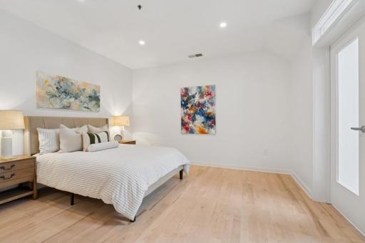 Soaring ceilings and natural light make this bedroom feel even more expansiveâyour personal oasis at the end of the day.
