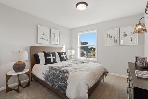 Bedroom 4 - photo represents similar floorplan but not identical. Staged model in another community. Finishes and selections may vary. See listing realtors for details.