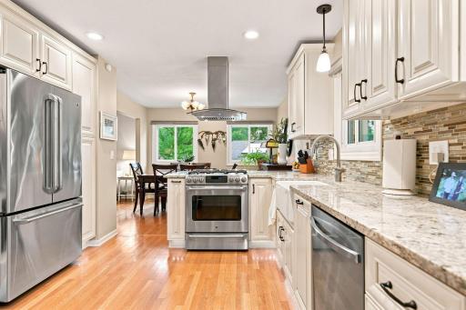 Beautifully remodeled kitchen with custom cabinetry and stainless steel appliances