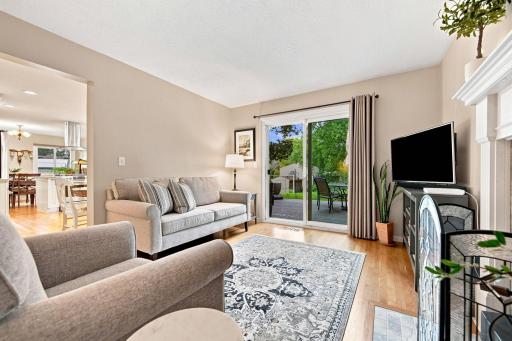 Inviting family room with wood-burning fireplace and backyard access