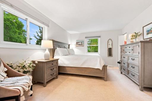 Spacious primary bedroom with private 3/4 bath