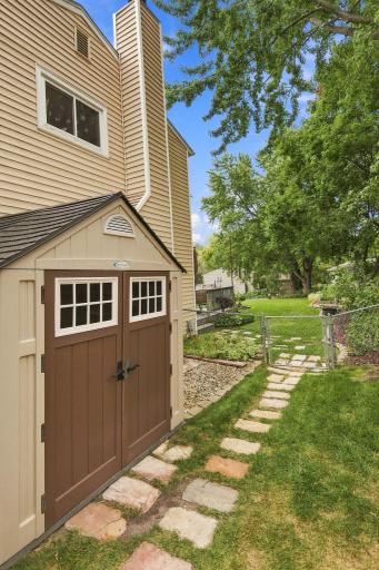 Convenient backyard storage shed included