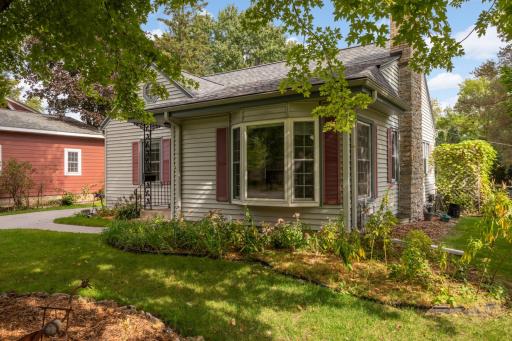 Lush perennial gardens surround this lovely home.