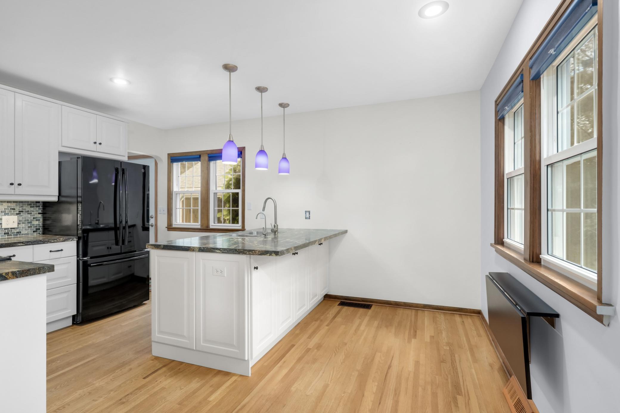 Renovated in 2012, the kitchen offers a breakfast bar and flip-up table for casual dining.
