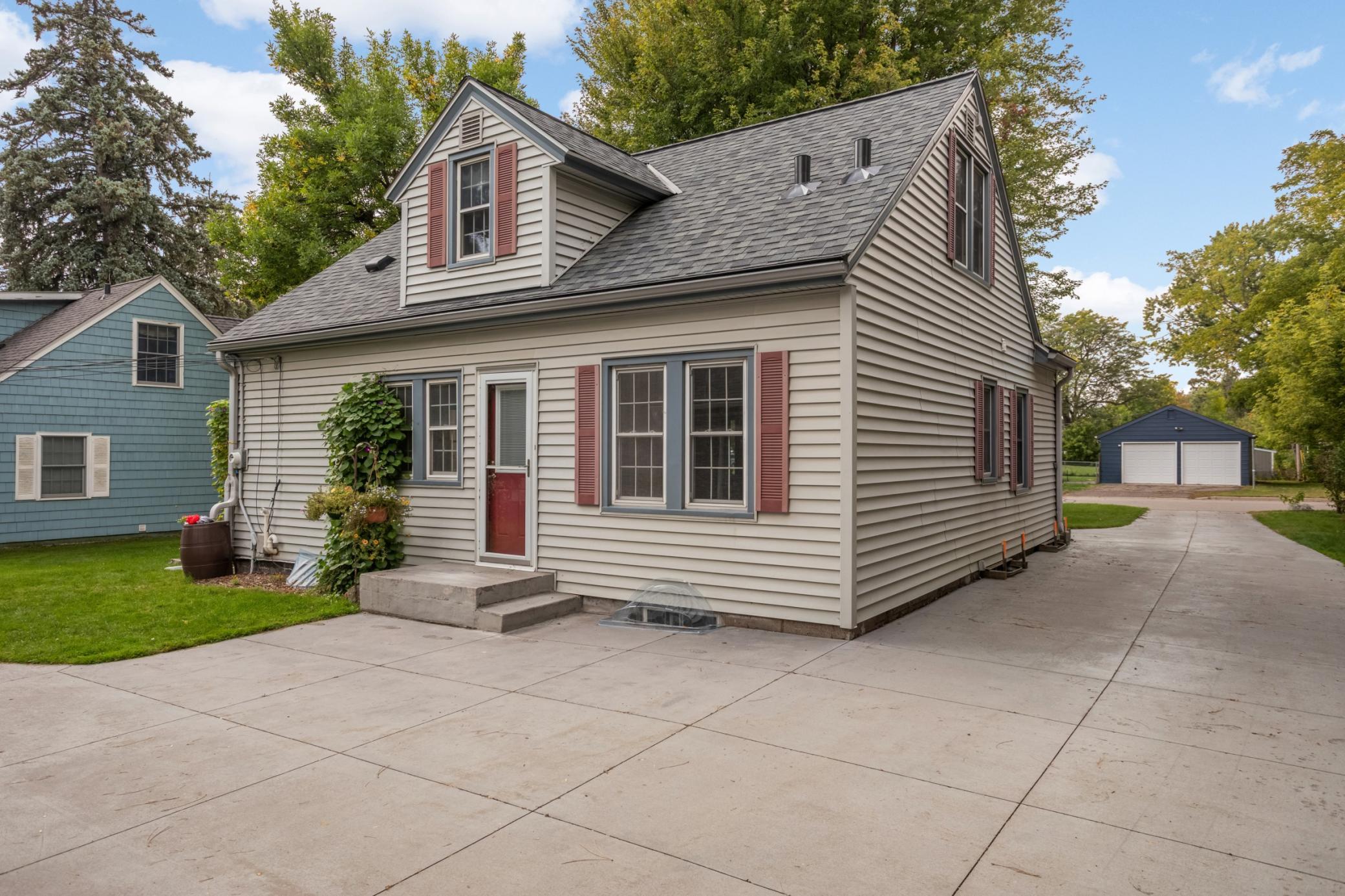 A view of the house from the backyard. The concrete driveway was installed in 2016.