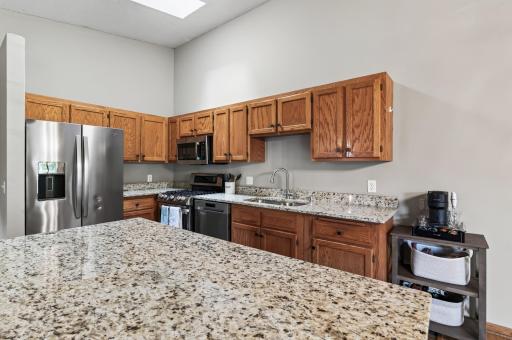 Generous counter space and an abundance of cabinetry provide plenty of room for meal prep, storage and everyday organization.