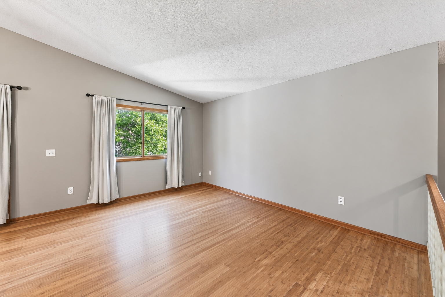 Durable bamboo flooring flow throughout the living room, informal dining area and into each upper level bedroom.