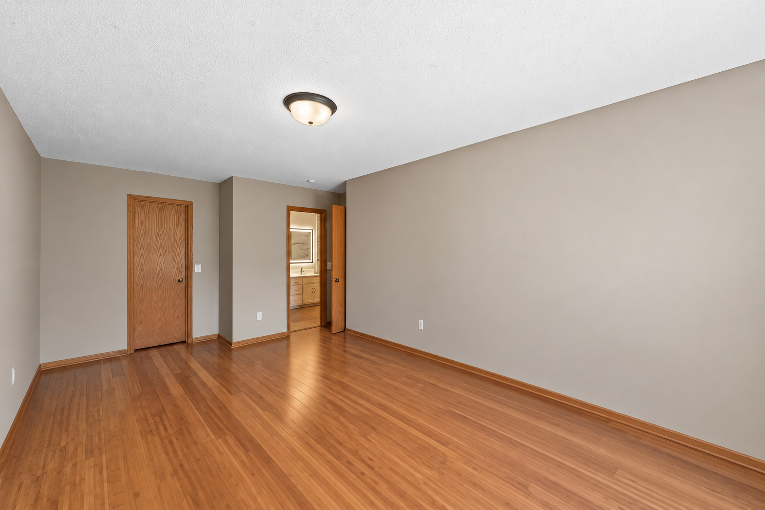 Complete with a walk-in closet and convenient access to the full walk-through bathroom.