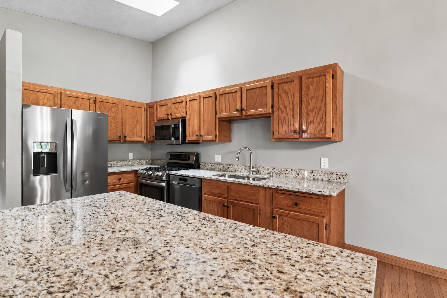 Generous counter space and an abundance of cabinetry provide plenty of room for meal prep, storage and everyday organization.