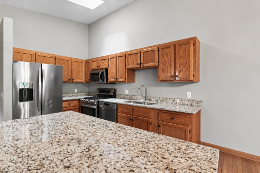 Generous counter space and an abundance of cabinetry provide plenty of room for meal prep, storage and everyday organization.