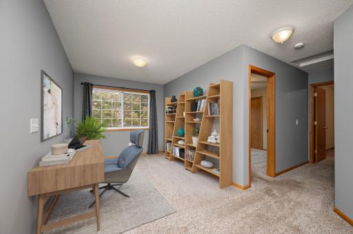 Versatile loft space perfect for a home office, game room or exercise room!