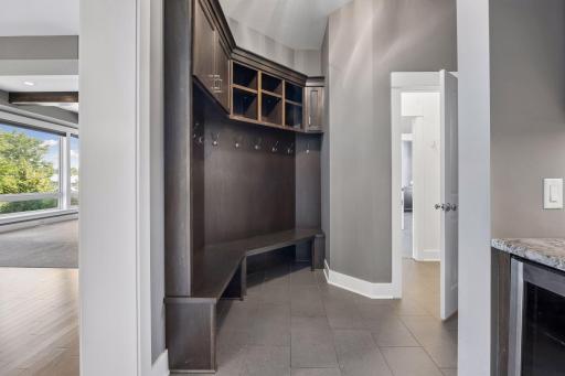 Custom built mudroom with cabinets for winter wear