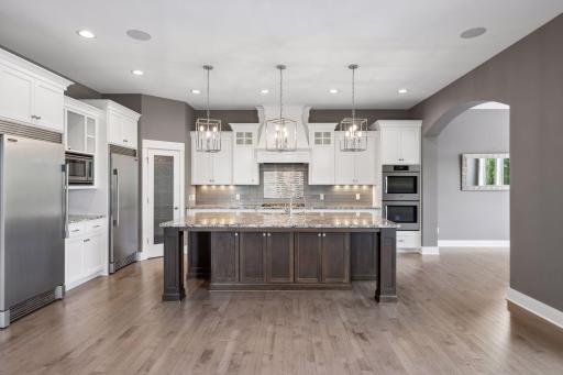 Custom pendant lights, Walk in pantry, lots of cabinets and storage for large pots and pans