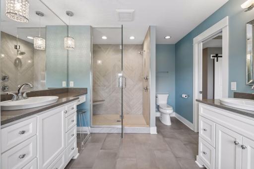 Don't miss the fully tiled shower that spells LUXURY!