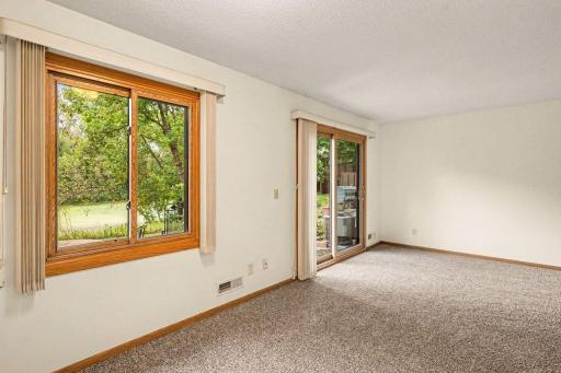 Patio door leads to private patio with pond view