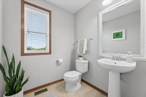 Bright and spacious main level with a conveniently located half bathroom.