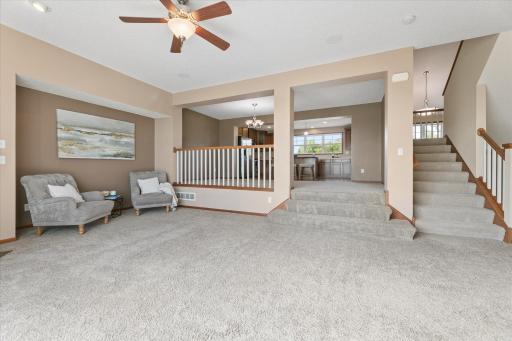 Spacious living room that flows seamlessly into the open-concept dining area and kitchen.
