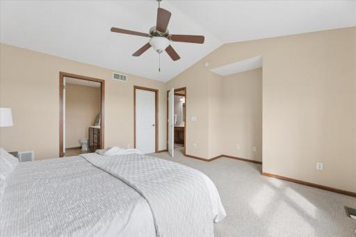 A spacious primary suite with generous walk-in closet space.