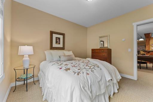 An additional bedroom with a walk-in closet provides flexible space for guests.