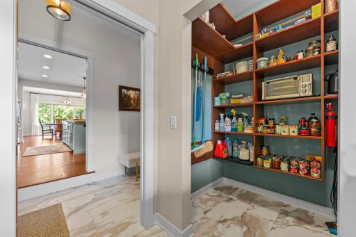 The laundry room and pantry is also conveniently located near the attached garage entry and a nearby half bathroom.