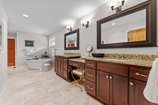 A look at the dual vanities, offering plenty of counter space and ample storage.