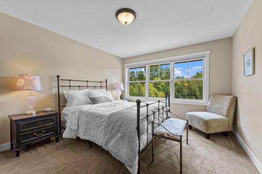 Spacious and inviting, Bedroom three features carpeting, a large window, and generous closet space.