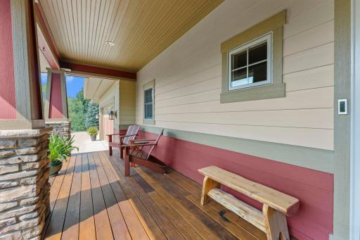 A spacious west-facing front porch provides the perfect spot to enjoy your morning coffee and take in the peaceful surroundings.