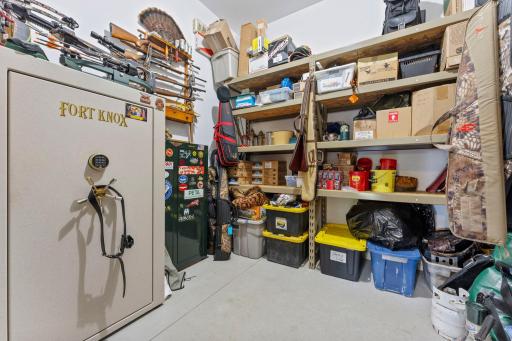 A secure, locked storage room provides additional storage space, making this garage truly exceptional for car enthusiasts, hobbyists, or anyone needing plenty of room for projects and storage.