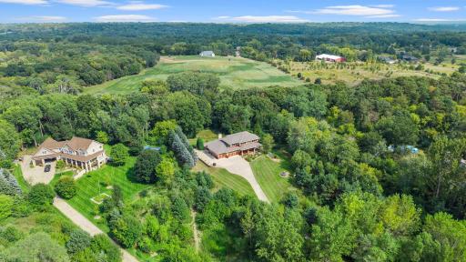 From front to back, the property exudes curb appeal, with a long oversized concrete driveway leading to a beautifully maintained exterior.