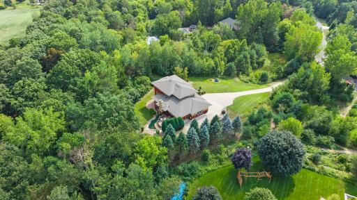 An aerial view showcasing this stunning home and expansive property.