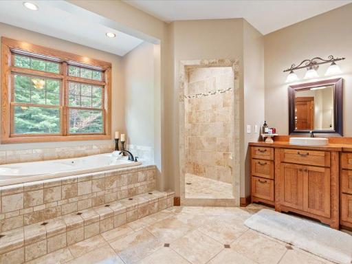 Private master bathroom with tub and shower