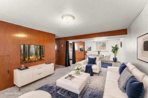 Lower level family room to right virtually staged