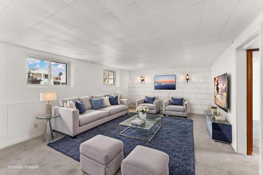 Lower level family room to left virtually staged