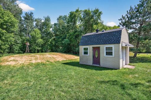 Large storage shed with lofted space is great bonus space in the private, peaceful backyard. Surrounded by nature