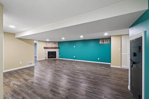 Large family room with gas fireplace. Fully finished basement.